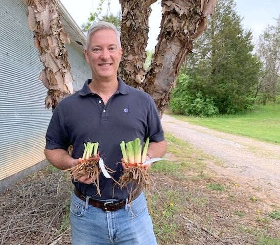 Ken Oakes holding daylilies